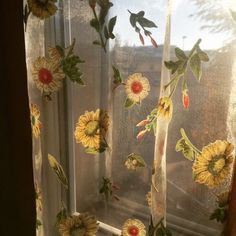 the sunflowers are painted on the sheer curtain