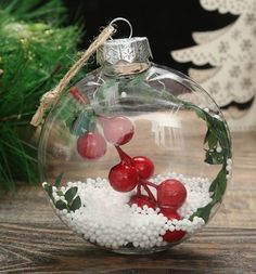 a glass ornament with berries and mist