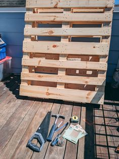 some tools are laying out on a wooden deck