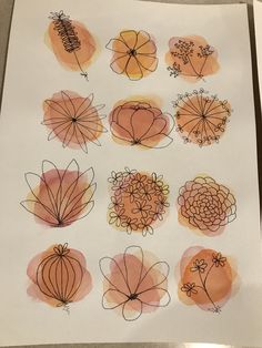 a bunch of flowers drawn on top of a piece of paper