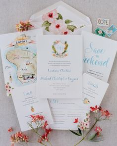 the wedding stationery is laid out on top of each other