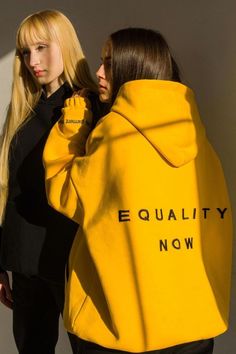 Looking for a hoodie that shows your support for gender equality? Look no further than this cotton-blend hoodie designed by Ukraine fashion talent FEMKA. This yellow oversized hoodie features black text across the back that symbolizes the founder's passions for equality. Shop now at doors.nyc and #supportUKAINE Ukraine Fashion, Fluid Fashion, Hoodie Yellow, Gender Fluid Fashion, Gender Fluid, Yellow Hoodie, Gender Equality