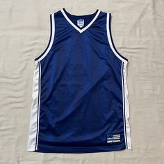 Good condition, and measurements are shown in the pictues as well. Feel free to DM any questions! ESS1 Sleeveless Blue Tops For College, Collegiate Blue Sleeveless Tops, Blue Sleeveless Collegiate Tops, Blue Sleeveless Collegiate Style Top, 90s Blue Sports Top, Blue Basketball Jersey, Blue Basketball, 90s Adidas, Baskets Adidas