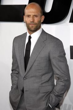 To get Jason Statham’s style bald men look, you can shave your head or try a short stubble look. However, you’ll need to grow out your stubble just slightly and maintain with a longer guard on your electric beard trimmer to get Statham’s beard. Along with his incredible acting skills, he has also never had any problems with women, according to his fiancee Rosie Huntington-Whiteley.