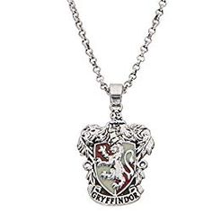 a harry potter necklace with the hogwarts crest on it's front and back