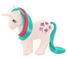 a toy horse with green and red manes on it's back legs, standing in front of a white background