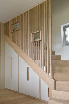 the stairs are made of wood and white