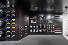 a room filled with lots of different types of clocks and magnets on the wall