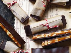 several pieces of chocolate and candy on top of paper