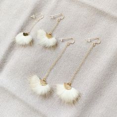 Luxurious fur dangle earrings in 14 karat gold. Chain is 14 karat gold oval with detailing. (USA) 14 Karat gold french ear wires. Clear safety backs included. Available in Natural, Moss and Flamingo fur with gold detail. Choose Regular (2.5”) or Long (4”). Made in USA. Comes in linen travel pouch. White 14k Gold Dangle Jewelry, White 14k Gold Dangle Linear Earrings, 14k Gold Dangle Jewelry With French Hook, Oval Gold Jewelry With French Hook, Oval White Brass Jewelry, Travel Pouch, Gold Details, Ear Wires, Gold Chain