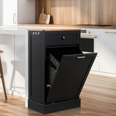 an open cabinet in the middle of a kitchen