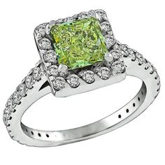 This stunning 14k white gold ring is centered with a lovely GIA certified princess cut natural fancy light even color diamond that weighs 1.18ct. graded with SI1 clarity. The center stone is accentuated by dazzling round cut diamonds weighing approximately 0.75ct. graded G color with VS clarity. The ring is size 5 1/4, and can be resized. Inventory #71752ASSS Fancy Light, Fancy Lights, Fancy Diamonds, Gold Engagement Ring, Diamond Gold, 14k White Gold Ring, Gold Engagement, Engagement Rings Sapphire, Gold Engagement Rings