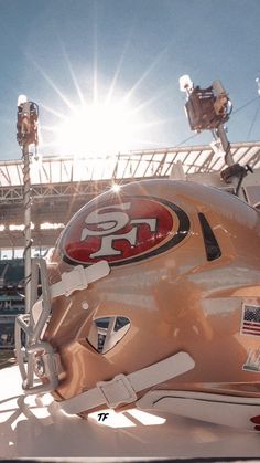 the helmet is on display in front of an empty stadium