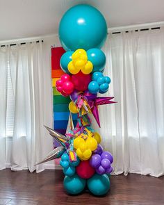 the balloon column is decorated with balloons and streamers