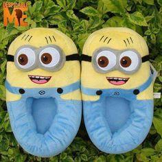 a pair of slippers that are shaped like minion from the movie despicable me