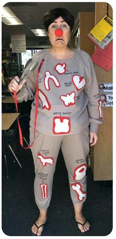 a woman is dressed up as a clown with scissors in her hand and mouth painted red