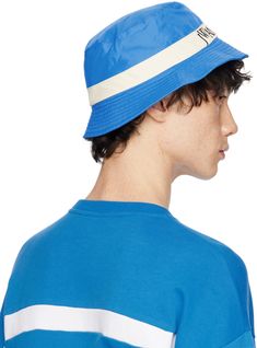 Nylon-blend taffeta bucket hat in blue. · Logo embroidered at face · Quilted brim Supplier color: Blue/White Sporty Bucket Hat With Curved Brim, Sporty Blue Hats For Summer, Sporty Blue Summer Hats, Blue Cotton Bucket Hat With Flat Brim, Blue Bucket Hat For Outdoor, Blue Visor Bucket Hat For Summer, Blue Visor Bucket Hat For Outdoor, Blue Bucket Hat With Visor For Outdoor, Casual Summer Nylon Bucket Hat