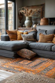 a living room filled with furniture and lots of pillows