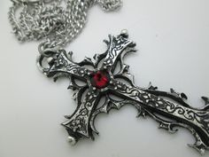 This Gothic cross necklace is an handmade pewter sculpture orned with an Austrian Swarovski or a real gem (My fav is the Black star Diopside, seriously) This gothic necklace is sold with a stainless steel chain of 18'' or 24'', if you would like to have a different length for the chain, you can write the desired length in the private note section when ordering :) This is a Gothic cross of 7cm This gothic cross necklace is a pewter sculpture of my own creation, i create and work the metal by myse Silver Cross Jewelry For Halloween, Gothic Cross Pendant Jewelry For Halloween, Halloween Silver Jewelry With Cross Pendant, Silver Cross Necklace For Halloween, Silver Cross Pendant Jewelry For Halloween, Gothic Metal Cross Jewelry, Gothic Cross Metal Jewelry, Gothic Metal Cross Necklace, Gothic Oxidized Cross Necklace