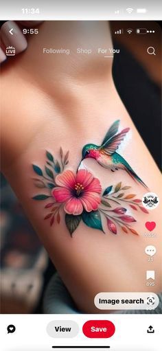 a woman's chest with flowers and birds on it, in the middle of an instagram