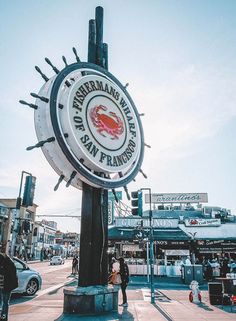 the sign for fisherman's wharf in san francisco is lit up by the sun