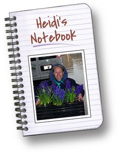 a note book with a photo of a woman holding purple flowers