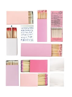 several matches are arranged in pink and white boxes with matching matchesticks on them