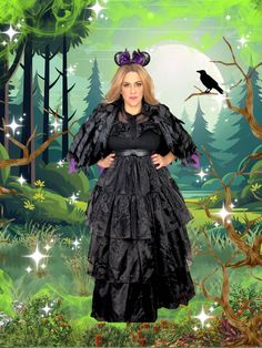 a woman wearing a black dress and hat standing in front of a forest with a bird on her head