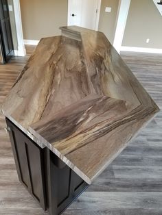 a kitchen island made out of wood and metal