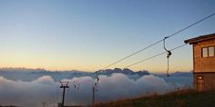 the sky is filled with clouds and some power lines