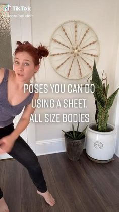 a woman is doing yoga in front of a wall with the words, poses you can do using a sheet all size bodies