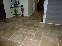 a tile floor in a house with stairs