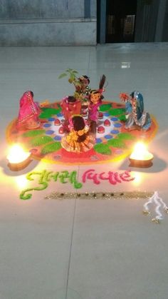 a decorated floor with candles and decorations on it for diwaling the hindu festival