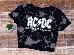 ACDC 80s Crop Top Fan Merch Rock Band AD ORIGINAL STYLE & COLOR IS BLACK BLEACHED CREW NECK CROP TOP Choose between V-Neck or Crew Neck Crop Tops Adult Sizes, Cotton/Polyester Blend. Black Font will be changed to white font if you order a black crop top to be more visible. CUSTOM ORDERS WELCOMED. We Carry Women Adult Sizes. All sizes, colors and options will be listed according to our inventory. SHIPPING FAST, FREE AND SAFELY IS OUR MAIN PRIORITY. WE LOVE ALL OUR CUSTOMERS AND TREAT THEM LIKE FA Distressed Rock Style Crew Neck Top, Casual Acid Wash Top For Music Festival, Black Distressed Rocker Tops, Acid Wash Band Merch Tops For Music Festival, Rocker Distressed Crew Neck Top, Rock Style Distressed Short Sleeve Top, Casual Acid Wash Top For Concert, Casual Band Logo Tops For Music Festival, Acid Wash Grunge Top For Music Festival