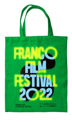 a green tote bag with the words nano film festival 2012 printed on it