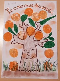 a child's drawing of an orange tree