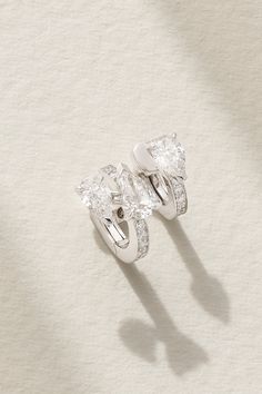 Repossi's single earring is part of 'Serti Sur Vide', which aligns with the jeweler's avant-garde collection. It's handcrafted from shining 18-karat white gold and set with a modern trio of pear-cut pavé diamonds. The sparkling design sculpts your lobe as if it's artistically floating. Luxury White Gold Baguette Cut Diamond Earrings, Luxury Platinum Baguette Cut Earrings, Luxury White Gold Baguette Cut Earrings, Luxury Pear-shaped Single Cut Diamond Earrings, Luxury Sterling Silver Pear-shaped Earrings, Luxury Pear-shaped Sterling Silver Earrings, Luxury White Earrings With Single Cut Diamonds, White Luxury Earrings With Single Cut Diamonds, Luxury Platinum Teardrop Diamond Earrings