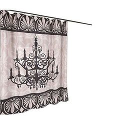 a chandelier hanging from a curtain with black and white designs on the fabric