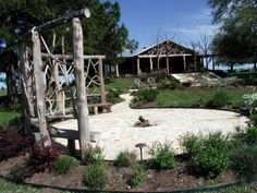 an outdoor garden area with a gazebo and stone walkway