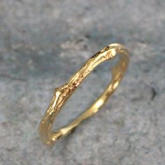 Gold Twig Ring Solid 18K Gold Cast Twig Band Branch Ring Woodland Wedding Rustic Ring Hand Cast Twig Wedding Band Women's Gold Twig Ring The perfect wedding ring for any nature lover, this organic shaped band is hand cast from a real twig in solid 18K gold! Sturdy, yet dainty, this band measures 1.5mm in diameter at its thinnest point and approximately 2.5mm in diameter at its widest. This makes it durable, yet comfortable. Your ring will be hand made just for you to size and either given a high Open Engraved Ring For Wedding, Gold Open Ring For Promise, Gold Open Ring Couple Rings For Wedding, Yellow Gold Couple Rings For Wedding, Yellow Gold Wedding Couple Rings In Fine Jewelry Style, 22k Gold Wedding Rings Fine Jewelry, Wedding Couple Rings In Yellow Gold, Yellow Gold Wedding Couple Rings Fine Jewelry, Gold Open Promise Ring