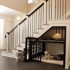 a dog house under the stairs in a home