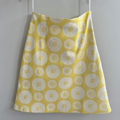 Can Be A Staple Or A Statement Piece Yellow A-line Summer Skirt, Yellow Pencil Skirt For Summer, Yellow Summer Pencil Skirt, Casual Yellow A-line Skirt, Retro Yellow Mini Skirt, Yellow Retro Skirt With Relaxed Fit, Yellow A-line Lined Skirt, Mustard Lined Skirt For Spring, Daisy Skirt