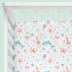 a crib sheet with sea animals on it