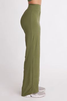 The Cut:When they said “she wears the pants,” these are the pants they meant. Made from recycled fabric in a brushed, vegan suede finish and featuring our signature figure-flattering high-waistband, these wide leg pants are an essential for the perfect capsule closet. Wear them to work and to your dinner date after. Featuring accent seams on the front and back and available in two inseams. Made using post-consumer recycled plastic — 84% RPET and 16% spandex. The Color:The results are in and gree Chic Olive Straight Leg Bottoms, Chic Straight Yoga Pants With Elastic Waistband, Olive Wide Leg Pants For Fall, Chic Olive High Waist Bottoms, Chic Olive High-waisted Pants, High-waisted Olive Pants For Work, High Waist Olive Pants For Work, Casual High Waist Pants With Side Slits, High Waist Olive Bottoms For Work