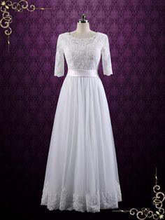 a white dress with lace on the waist and sleeves, in front of a purple background