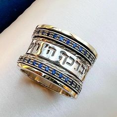 May the Lord Bless & Keep You Ring ✨ Handcrafted in Silver 925 & 14k Gold with Blue Sapphire Stones | A Divine Symbol of Faith & Protection! ✨ Divine Protection in Every Detail This stunning ring is meticulously handcrafted from high-quality Sterling Silver 925 and 14k Gold, creating a timeless piece that radiates elegance and grace. Adorned with exquisite Blue Sapphire Stones, this ring not only captures attention with its beauty but also holds a deep spiritual meaning that makes it truly speci Blue Sterling Silver Jewelry Stamped 14k, Blue Engraved Sterling Silver Rings, Engraved Blue Sterling Silver Rings, Sacred Jewelry, Divine Protection, Royal Beauty, Sapphire Stones, Sacred Symbols, Spiritual Meaning