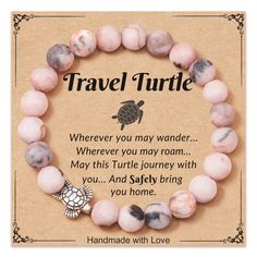 a bracelet with pink marble beads and a turtle charm on it that says, travel turtle