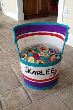 a colorful bucket with the name karlee on it