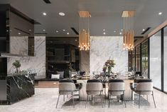 an elegant dining room with marble walls and flooring