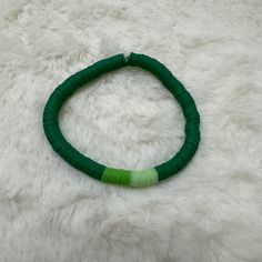 Beautiful handmade bracelet featuring three shades of green Heishi clay beads on a stretchy band. Size of bracelet in photo: 7 1/2 inches Bracelets Clay, Heishi Bead Bracelet, Clay Bead Bracelets, Heishi Bracelets, Clay Bead Bracelet, Clay Bead, Stackable Bracelets, Bead Bracelets, Heishi Beads